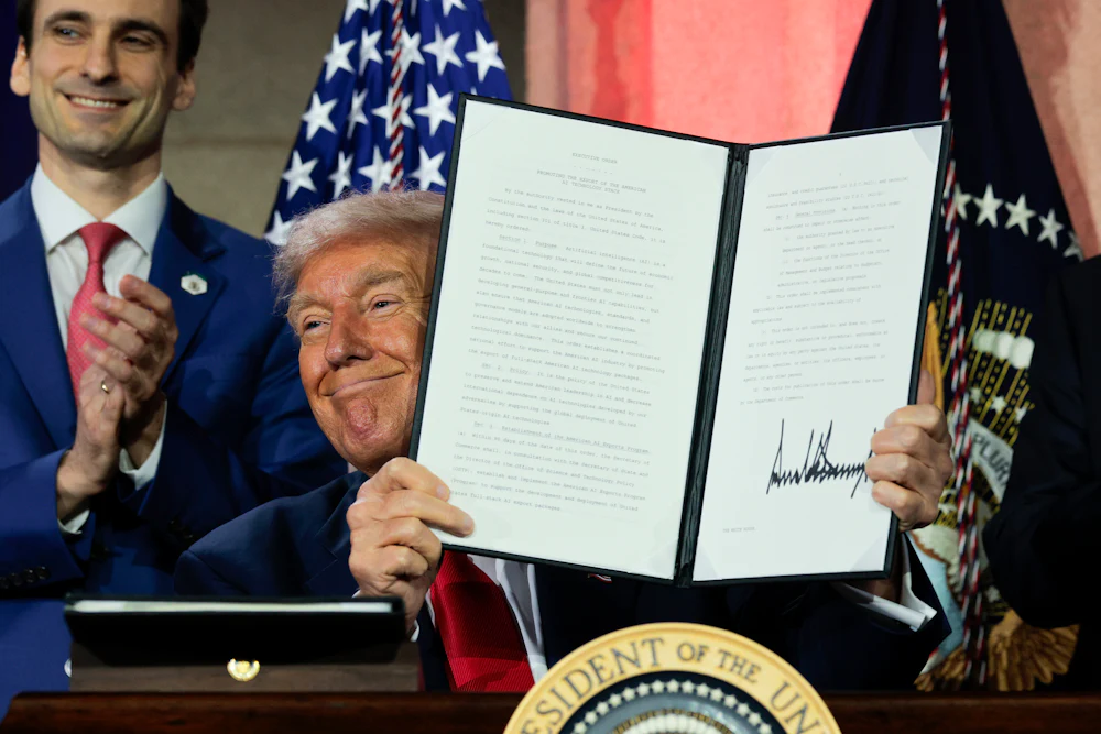 President Trump displays a signed executive order during the Winning the AI Race summit on July 23, 2025.