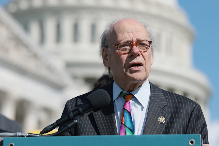 Representative Steve Cohen speaks at a podium in front of the Capitol
