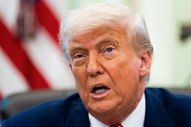 Donald Trump speaks while sitting in the Oval Office