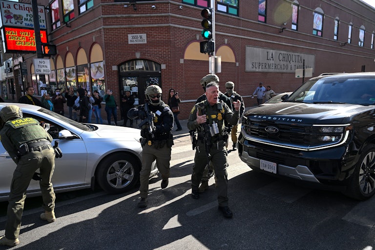 CBP Chief Gregory Bovino yells while walking in Chicago with masked federal immigration agents