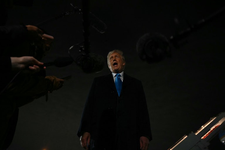 Donald Trump speaks to reporters outside Air Force One