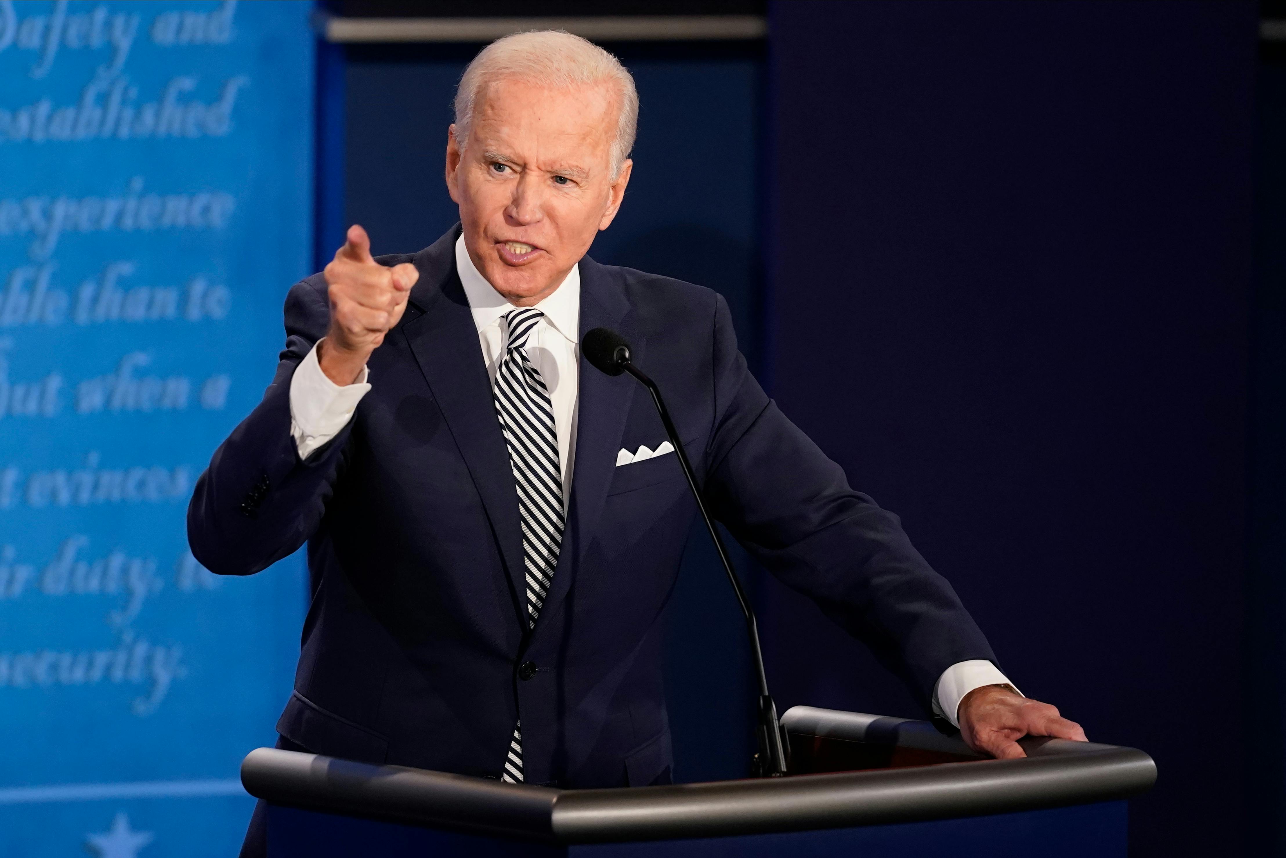 Joe Biden points his finger and speaks angrily at a presidential debate. 