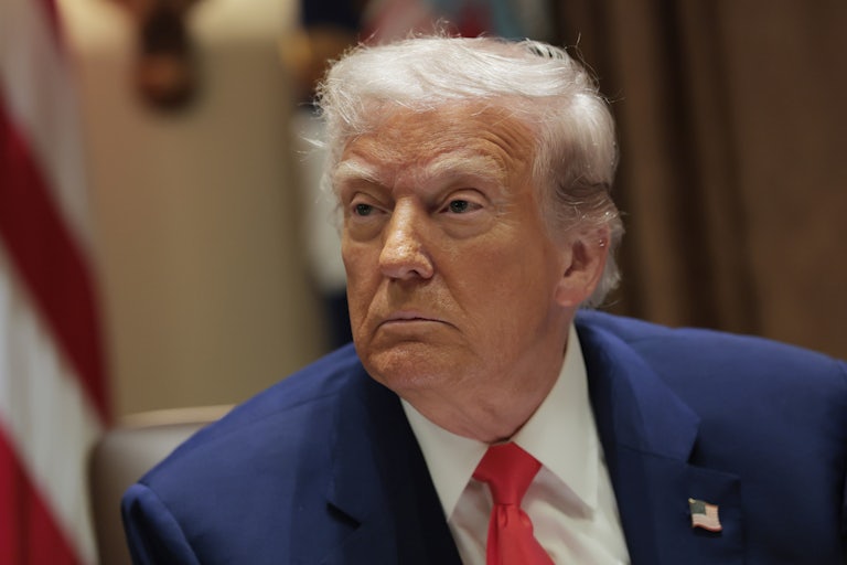 Donald Trump sits in a Cabinet meeting in the White House