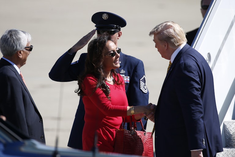 Donald Trump shakes hands with Harmeet Dhillon