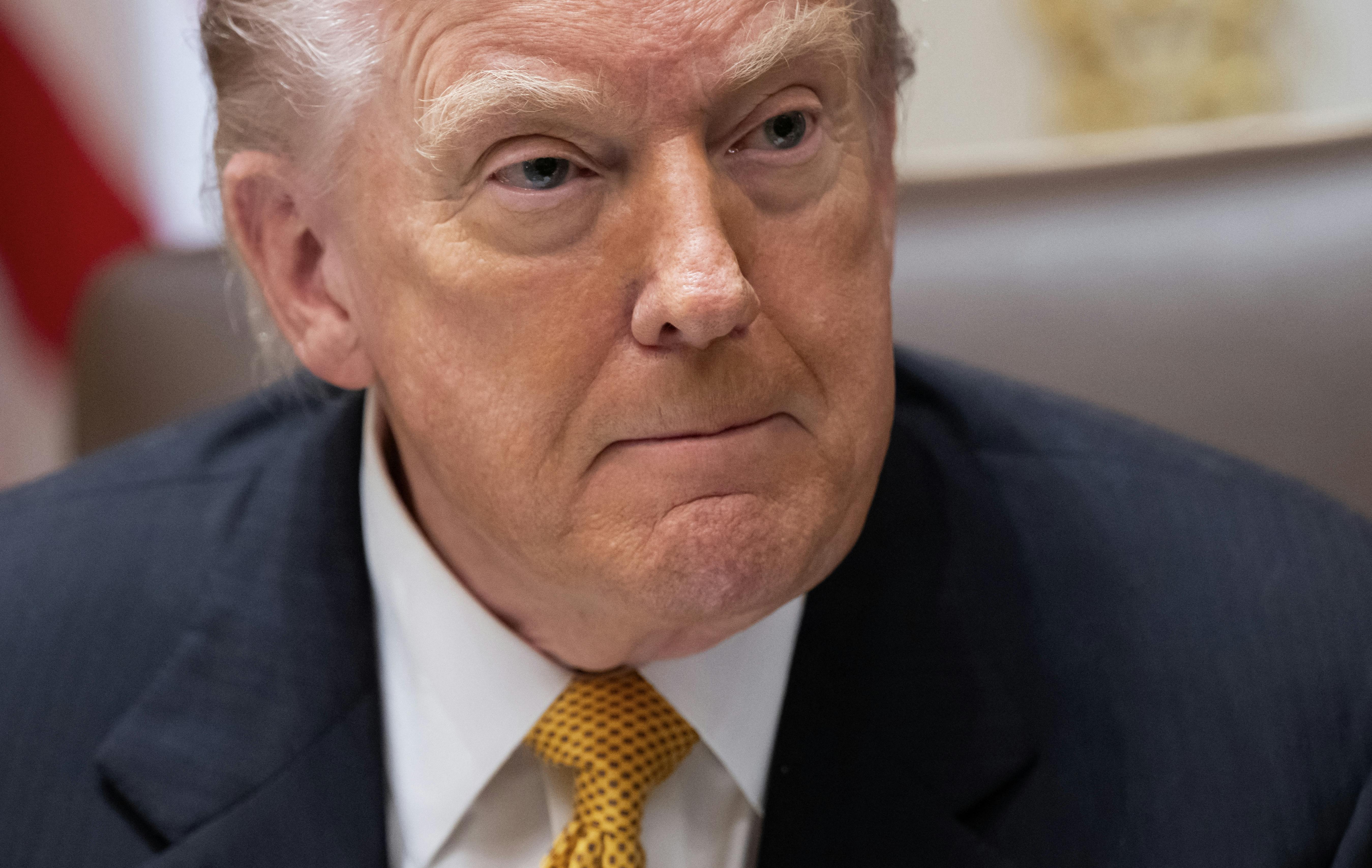 Donald Trump presses his lips together