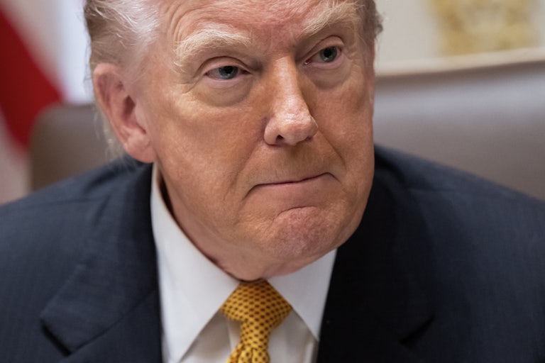 Donald Trump presses his lips together