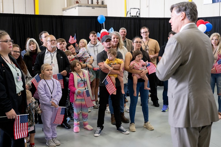 US Deputy Secretary of State Christopher Landau speaks to white South Africans who just arrived at Dulles Airport