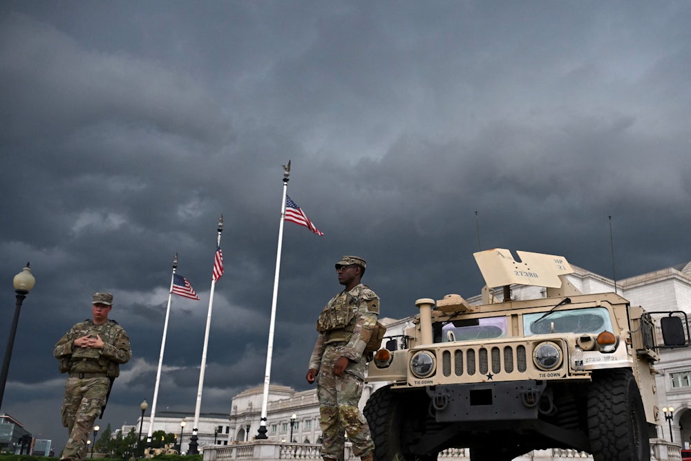 Members of the National Guard patrol outside Union Station as a storm approaches in Washington, D.C., on August 17, 2025. Donald Trump deployed military and federal law enforcement, ostensibly to curb violent crime in the nation’s capital.