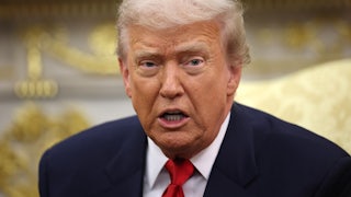 Donald Trump speaks while sitting in the Oval Office