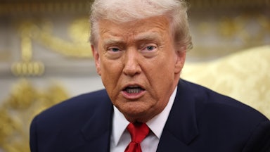 Donald Trump speaks while sitting in the Oval Office