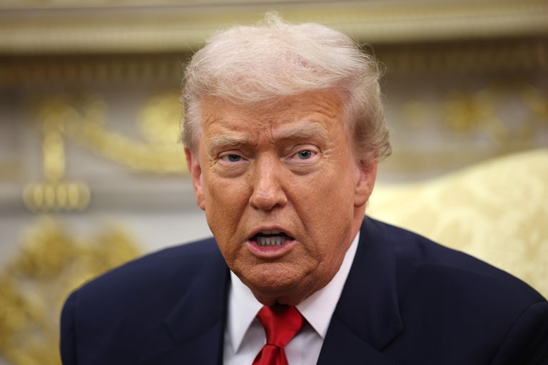 Donald Trump speaks while sitting in the Oval Office