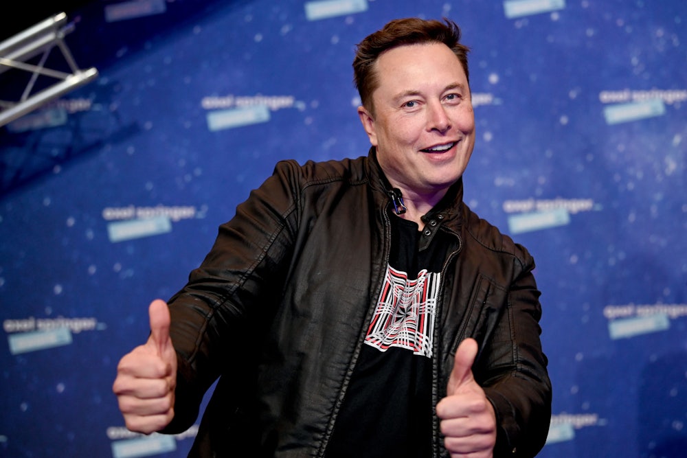 Tesla's Elon Musk makes a thumbs-up gesture.