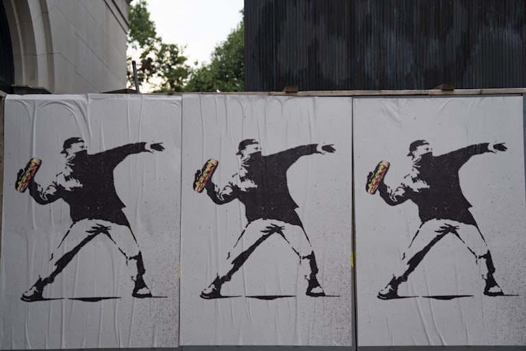Bansky-style street art of the sandwich guy in Washington, D.C.