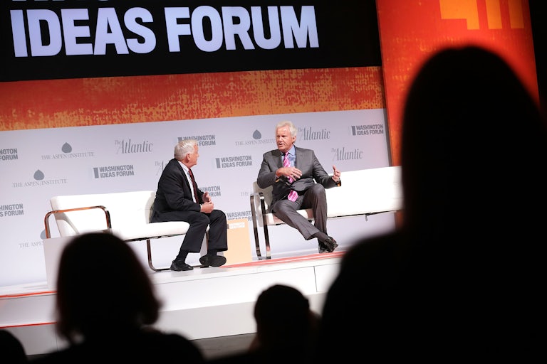 Aspen Institute President Walter Isaacson interviews GE Chairman Jeff Immelt on a stage at an ideas festival.