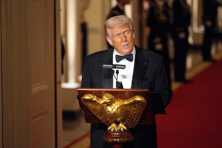 Donald Trump speaks at a podium during the National Governors' Association meeting