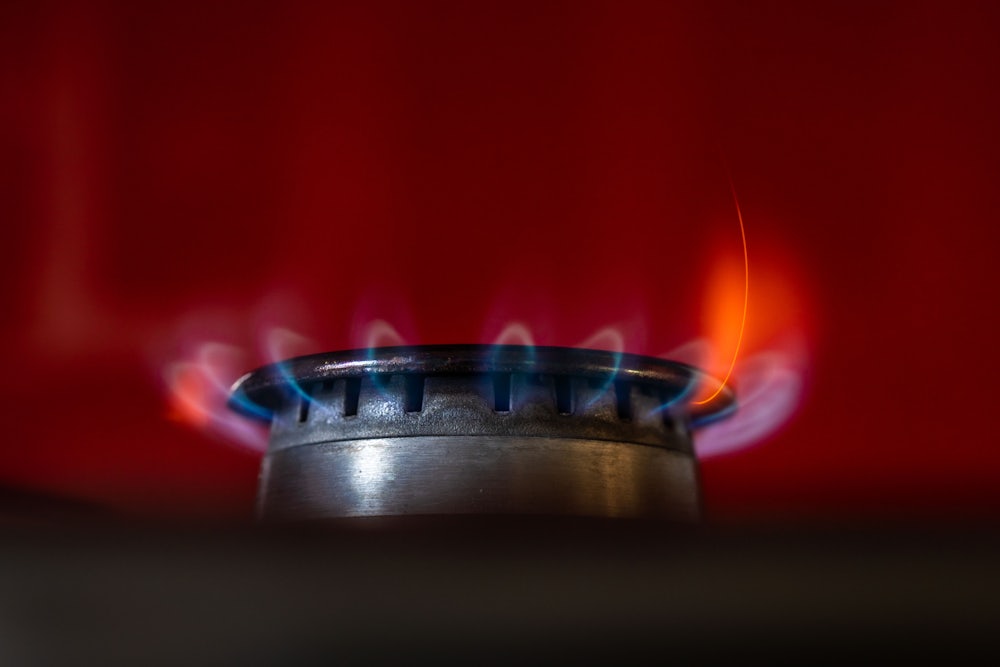 A close-up image of the flame of a gas stove