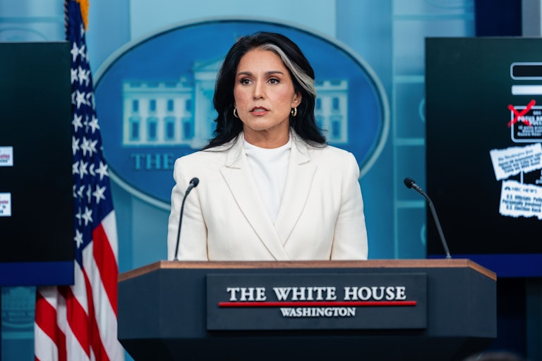 Tulsi Gabbard speaks while standing at the podium in the White House press briefing room