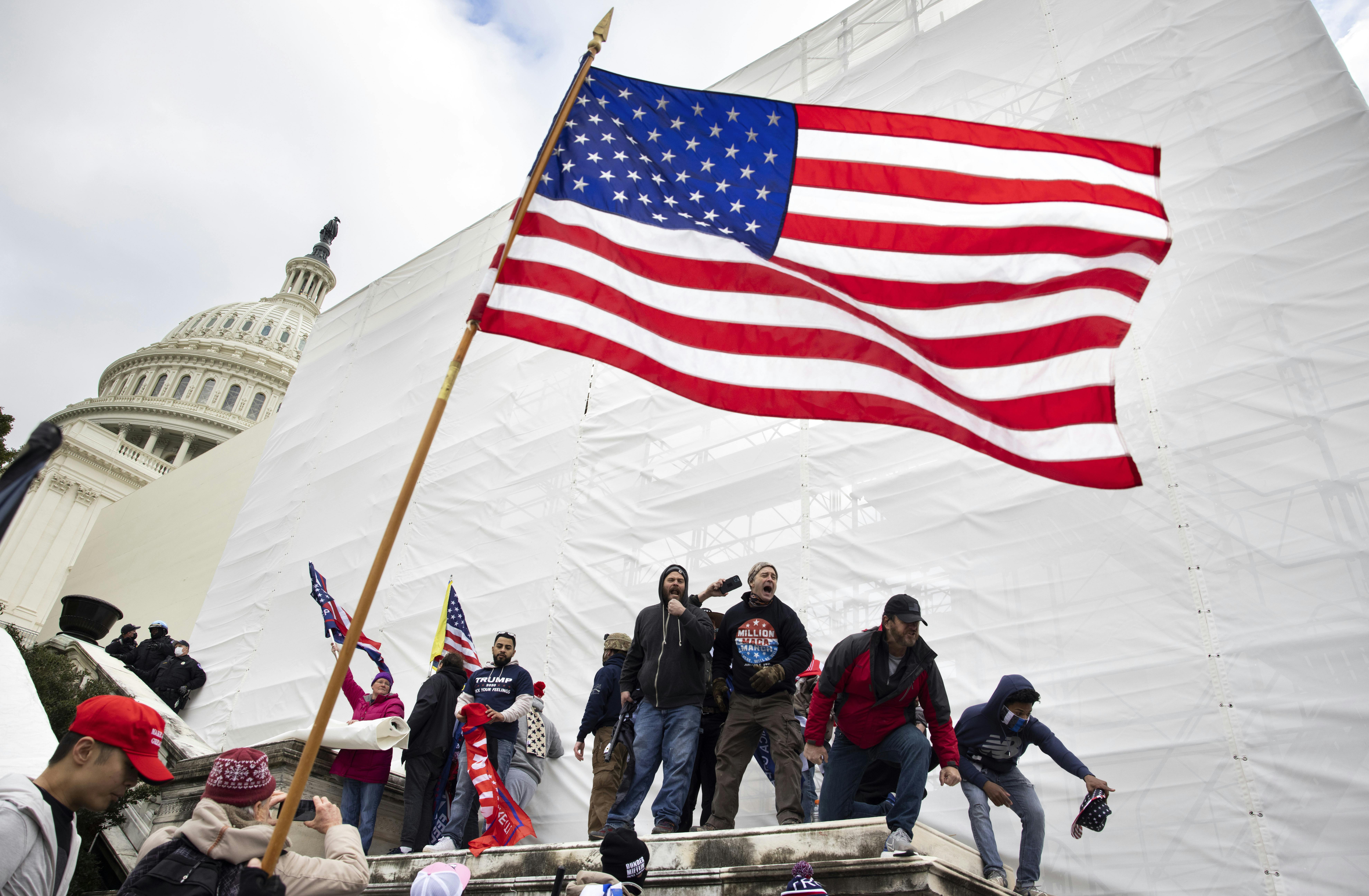 Trump supporters try to storm the US Capitol in Washington D.C on January 6, 2021.
