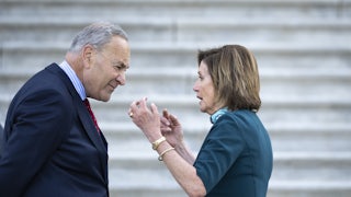 Chuck Schumer and Nancy Pelosi have a discussion on the steps of the Capitol.