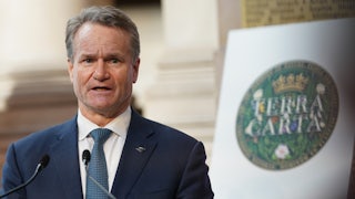 A man speaks into a microphone.