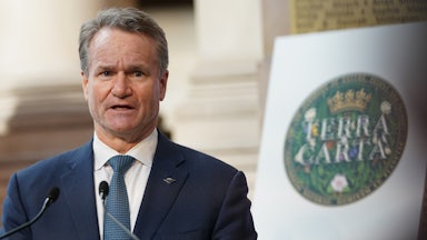 A man speaks into a microphone.