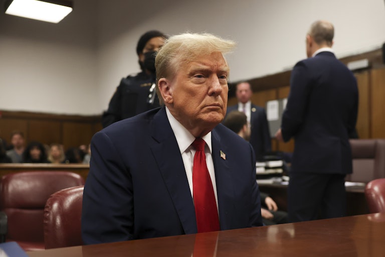 Donald Trump sits