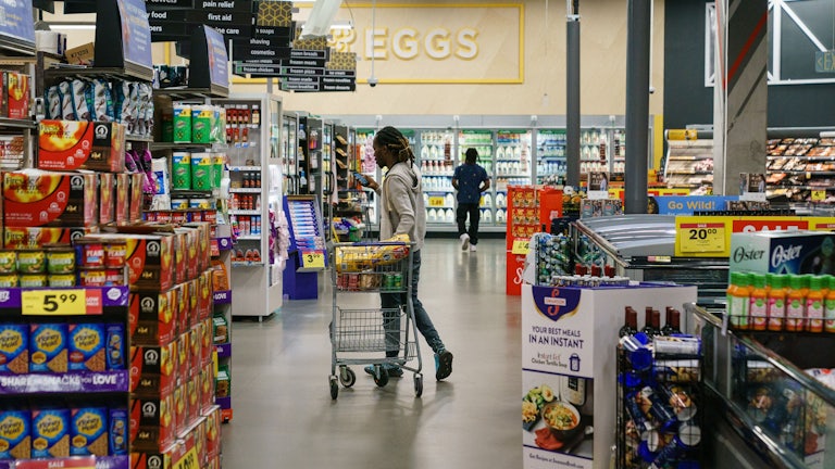 Shoppers are seen in a supermarket.