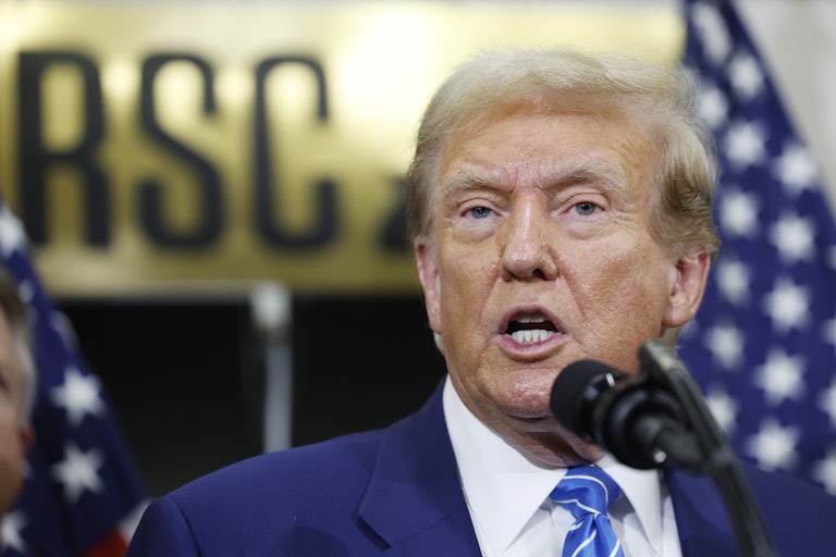 Donald Trump speaking at a mic