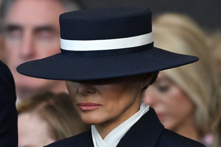 Melania Trump wears a ridiculous hat that covers her eyes during the inauguration of her husband.