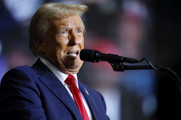 Donald Trump speaks into a microphone