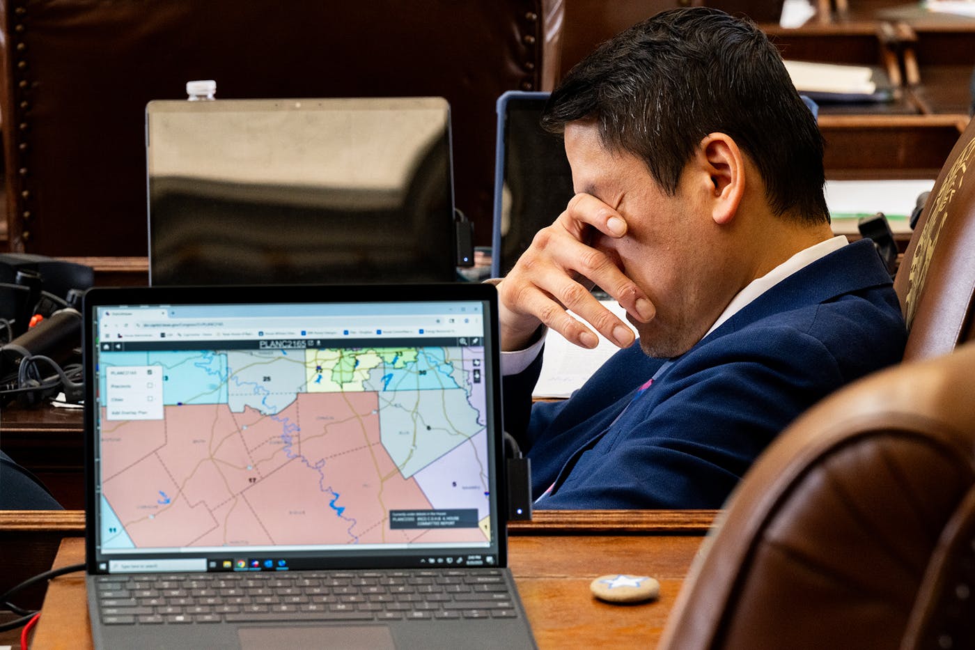 A photo of Texas House Democratic Caucus Chair Gene Wu reacting during a special session called last summer by Governor Greg Abbott to redraw the state’s legislative maps.