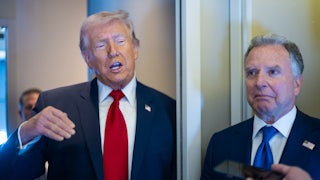 Donald Trump gestures and speaks to reporters on Air Force One while standing next to Steve Witkoff