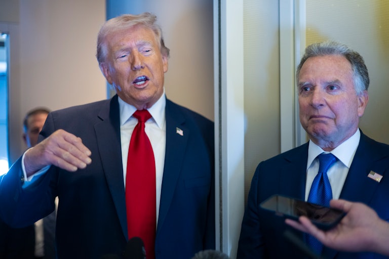 Donald Trump gestures and speaks to reporters on Air Force One while standing next to Steve Witkoff