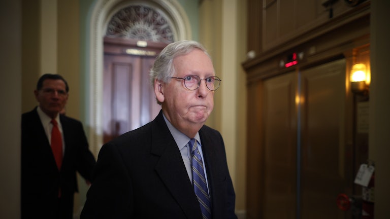 Senate Minority Leader Mitch McConnell arrives for a news conference following the Republican policy luncheon at the U.S. Capitol