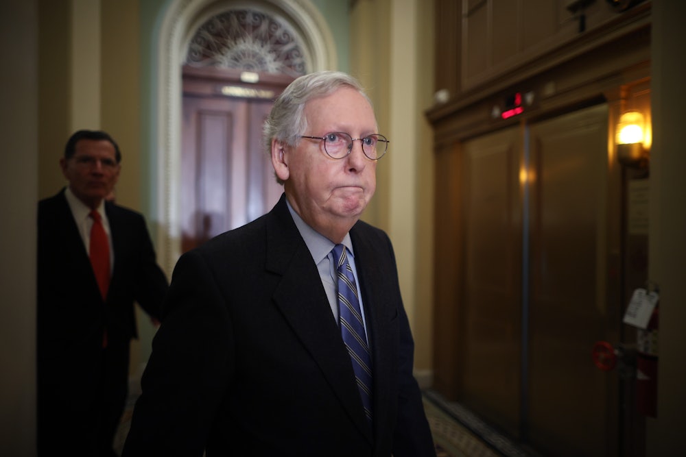 Senate Minority Leader Mitch McConnell arrives for a news conference following the Republican policy luncheon at the U.S. Capitol