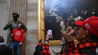 Supporters of Donald Trump photograph one another during the riot on Capitol Hill