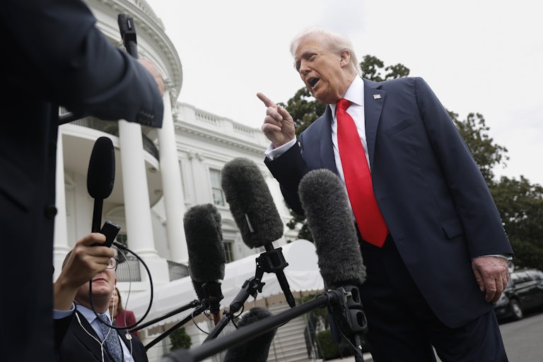 Donald Trump scolds reporters on the White House lawn.