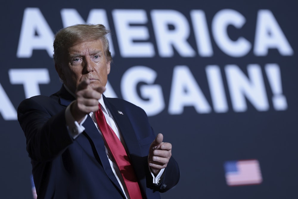 Former president Donald Trump point at the crowd at a rally in South Carolina.