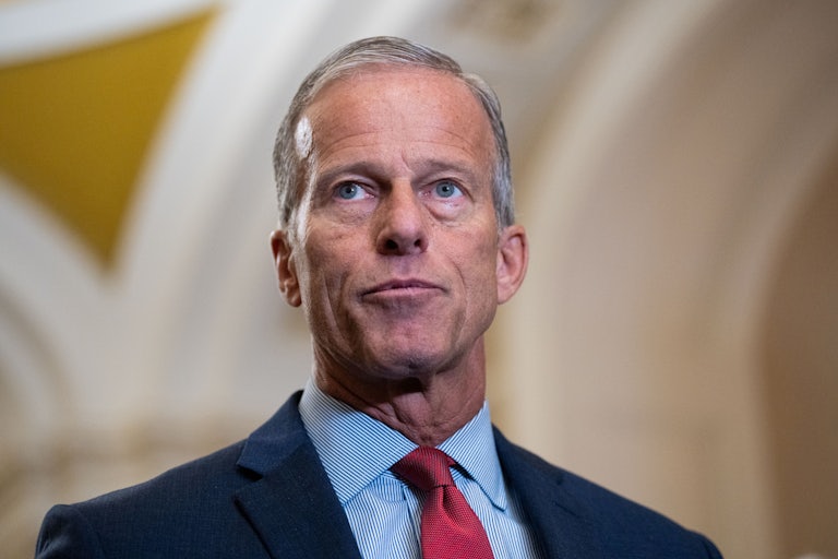 Senator John Thune looks up