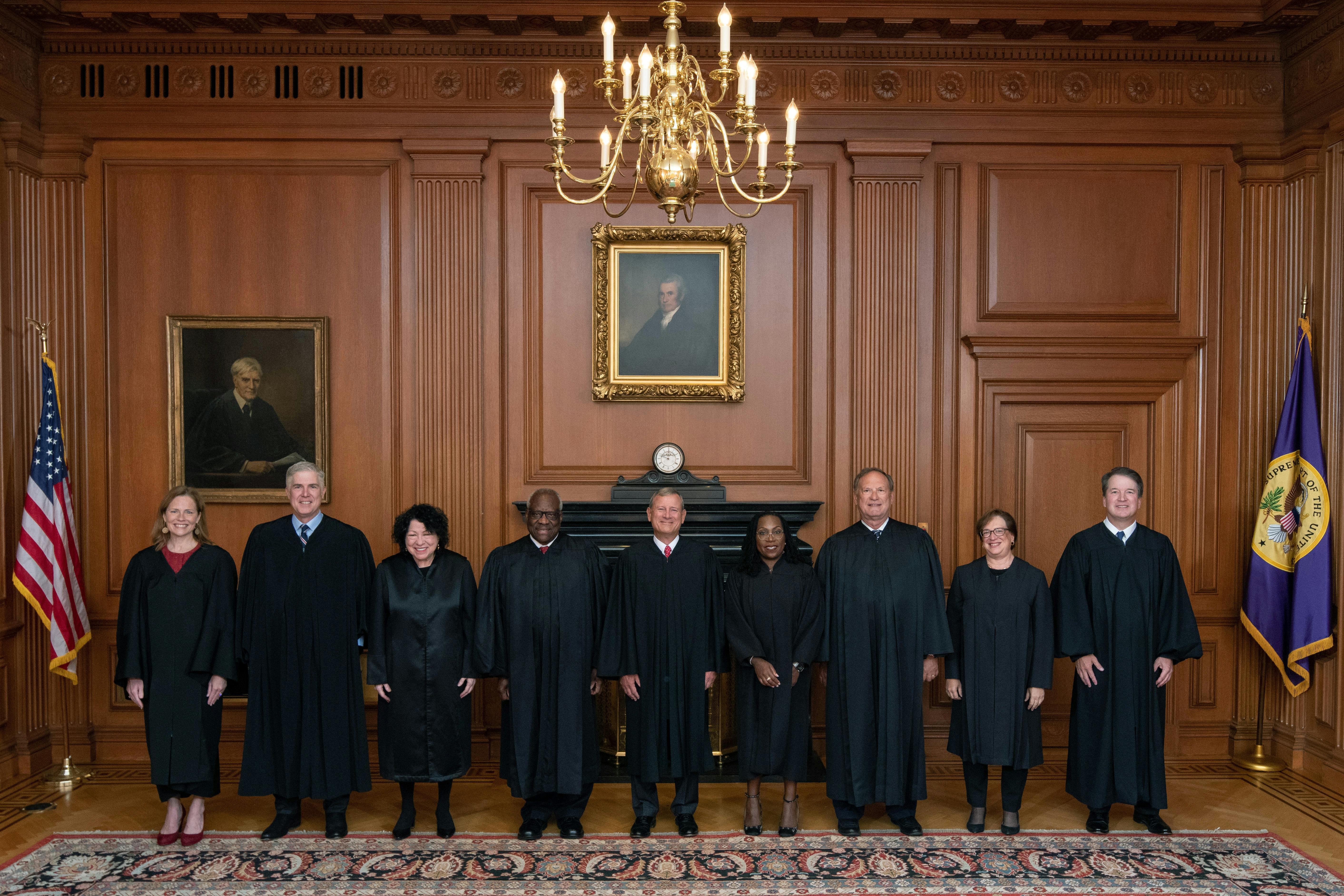 Members of the Supreme Court pose in the Justices Conference Room prior to the formal investiture ceremony of Associate Justice Ketanji Brown Jackson.