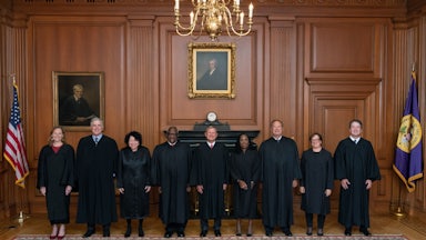 Members of the Supreme Court pose in the Justices Conference Room prior to the formal investiture ceremony of Associate Justice Ketanji Brown Jackson.