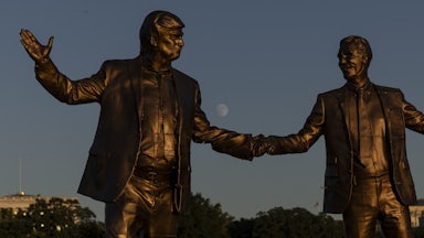 A statue of Donald Trump and Jeffrey Epstein holding hands