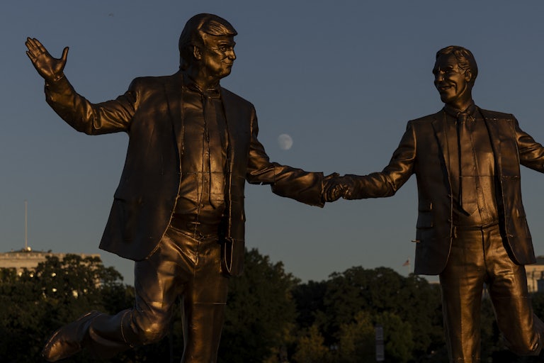 A statue of Donald Trump and Jeffrey Epstein holding hands