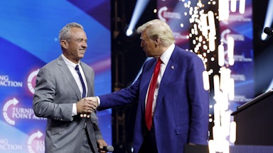 Donald Trump welcomes Robert F. Kennedy Jr. to the stage at a rally in Duluth, Georgia.