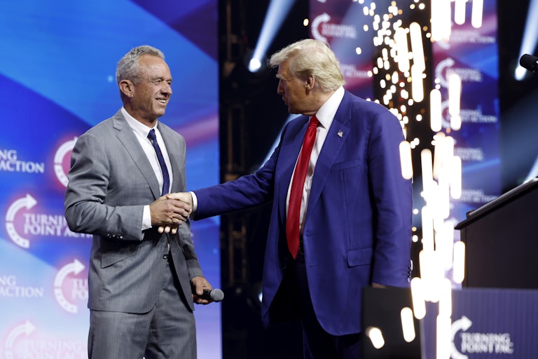 Donald Trump welcomes Robert F. Kennedy Jr. to the stage at a rally in Duluth, Georgia.