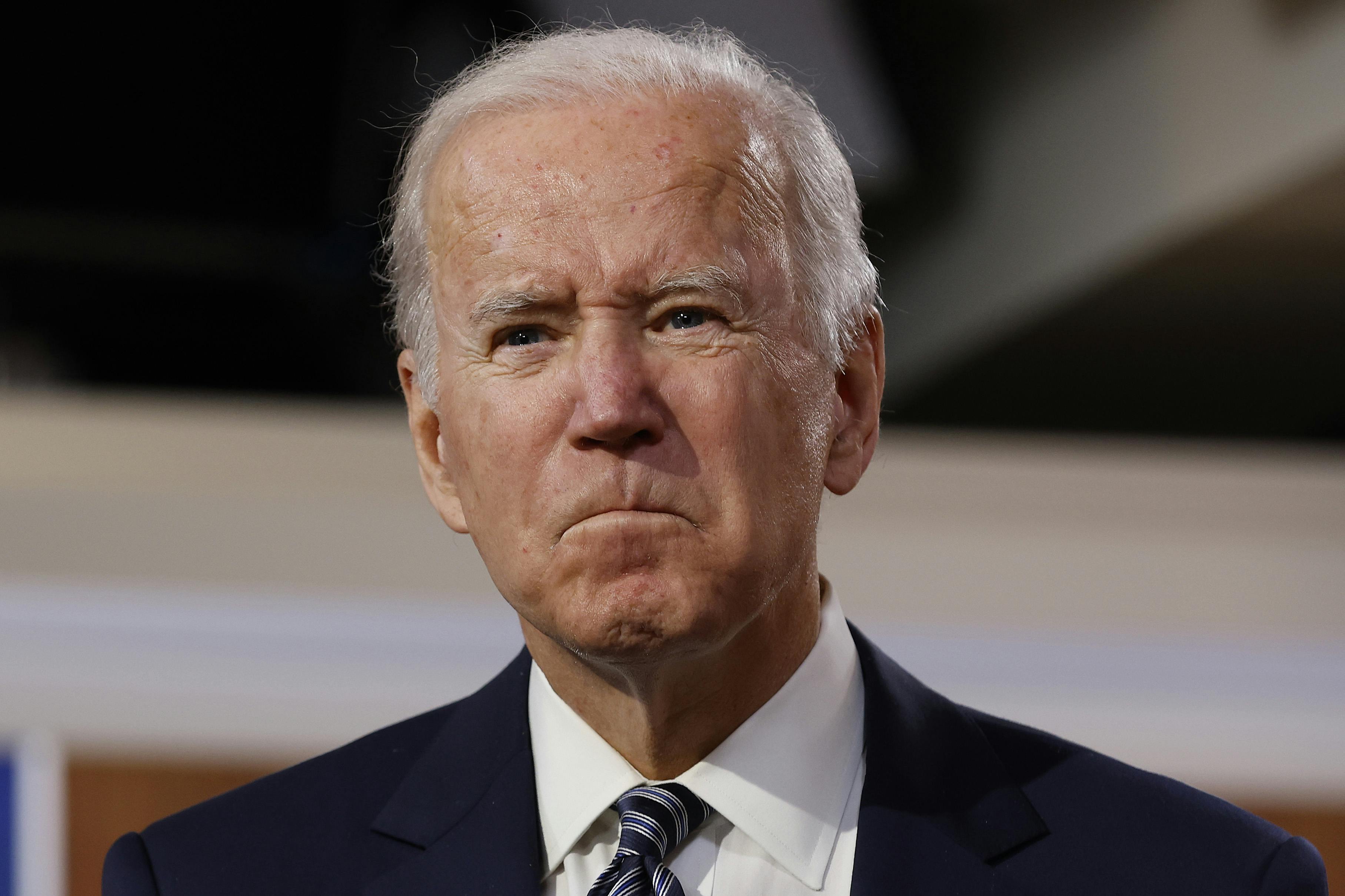 A close up of a stern President Joe Biden.