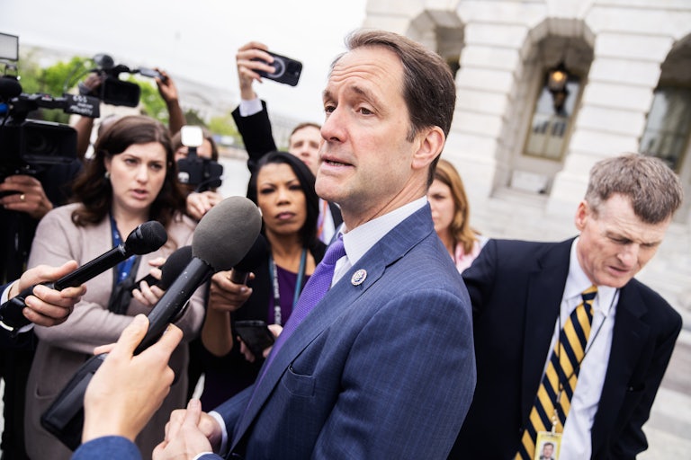 Jim Himes speaks to reporters