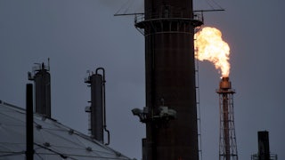 Flame spews from a steel tower.