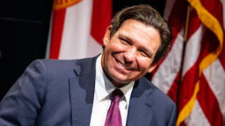 Florida Governor Ron DeSantis smiles