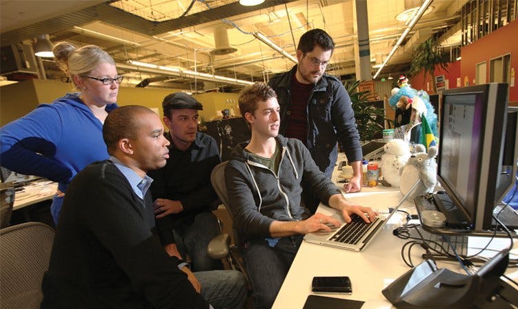 Dave Willner (far right above) consults with some of his troops at Facebook HQ. When necessary, the team blocks local access to content that runs afoul of foreign laws, while keeping it available to the rest of the world, as it did with these images and videos.